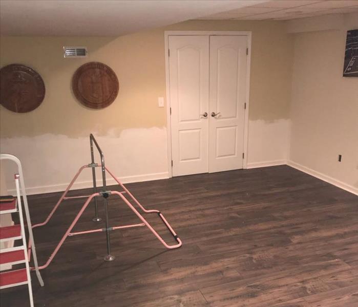 Completely restored room with new wood flooring.